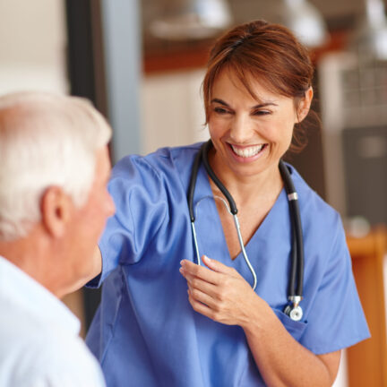Cropped shot of a female nurse checking on her senior patient
