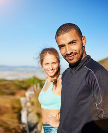 Running, happy and portrait of couple on mountain for workout, exercise and marathon training outdoors. Sports, dating and man and woman for cardio for health, fitness and wellness in morning.